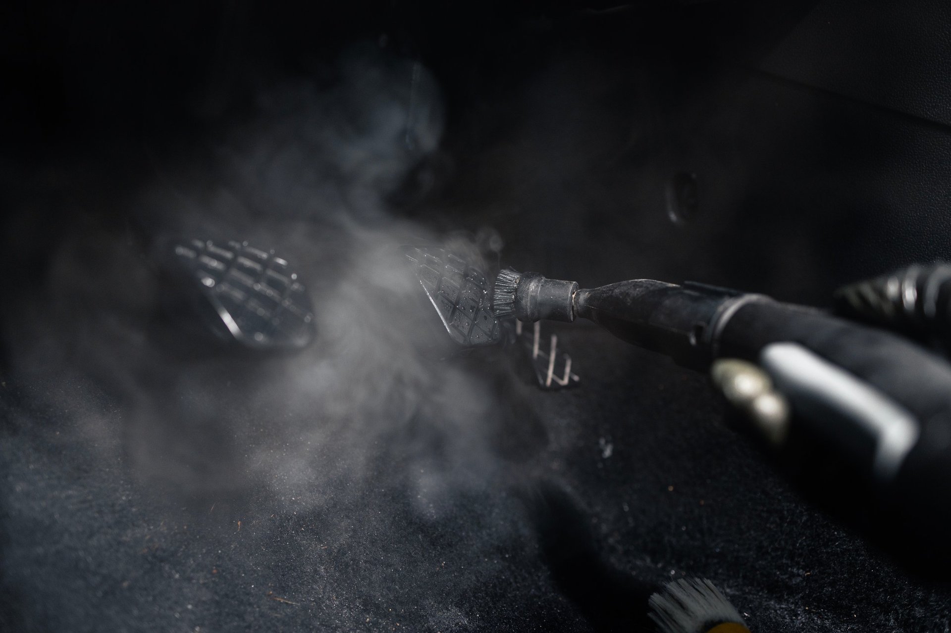 Professional cleaning of upholstery and interior surfaces with a steam cleaner