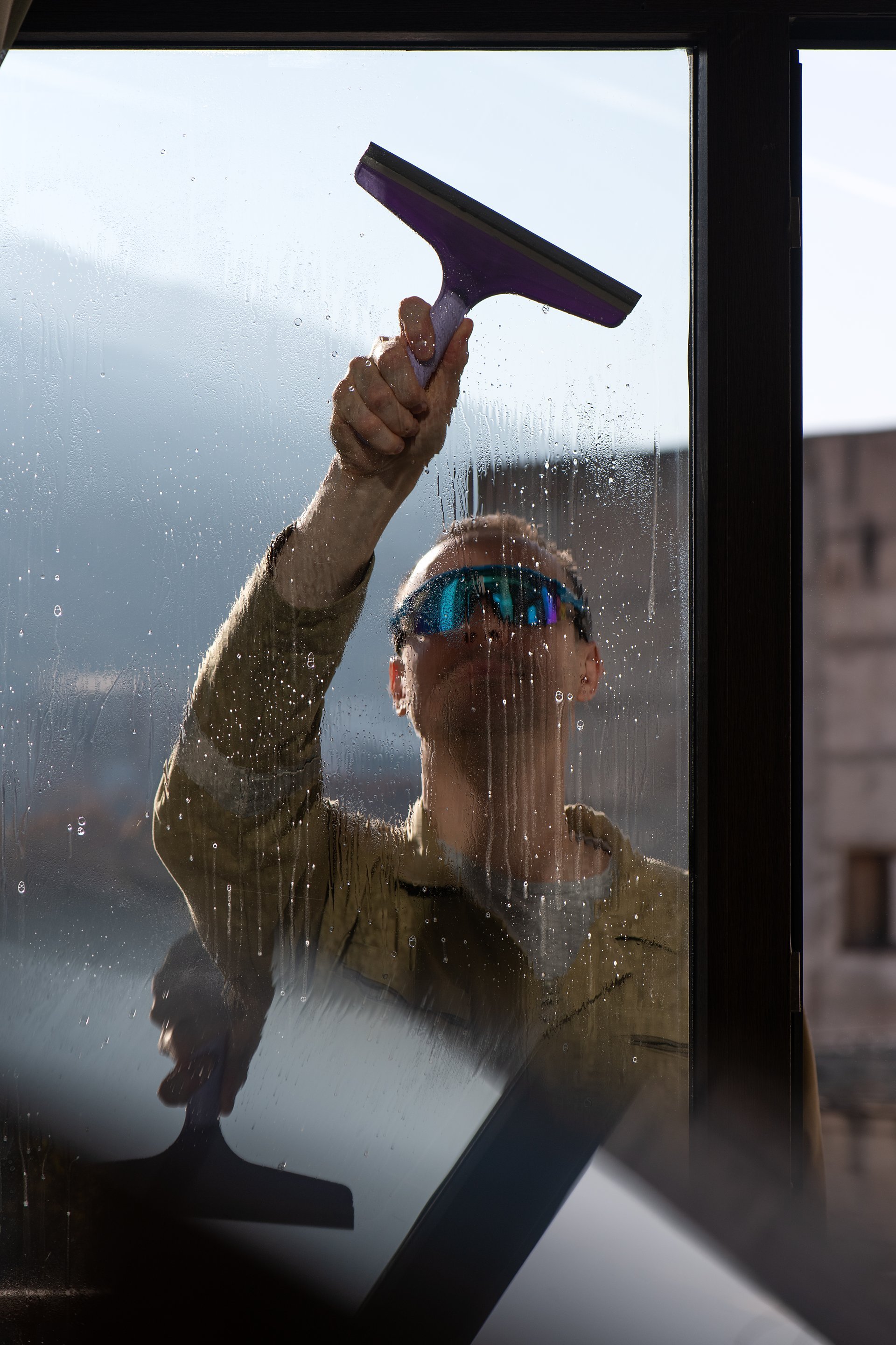 Professional window cleaning in urban setting