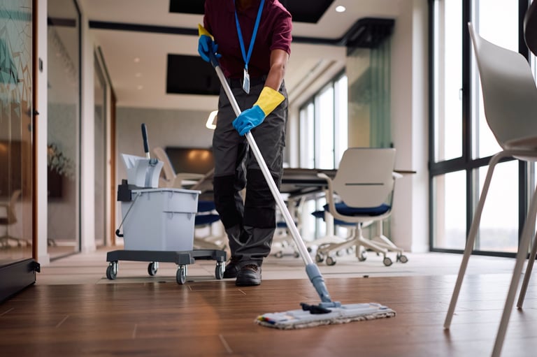 Professional deep cleaner thoroughly cleaning a modern London property